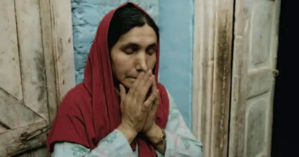 Kashmiri woman grieving silently at home reflecting the emotional toll of conflict in the valley
